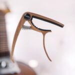 TAFFSTUDIO Capo Gitar Zinc Alloy Bridge Pin Remover QBJ Coklat Aksesoris Gitar Akustik Klasik Elektrik Dan Ukulele Bahan Logam Kuat Presisi Fungsi 2 In 1 Penjepit Senar Dan Pencabut Pin Gitar Kualitas Original Jadi Store Lamongan